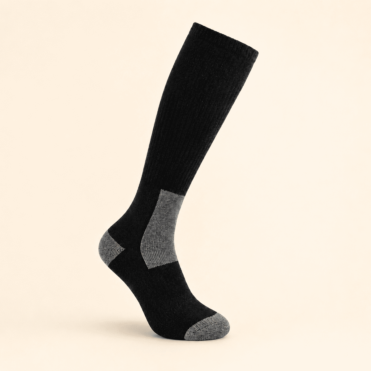 Black and grey alpaca ski and snowboard socks in snow