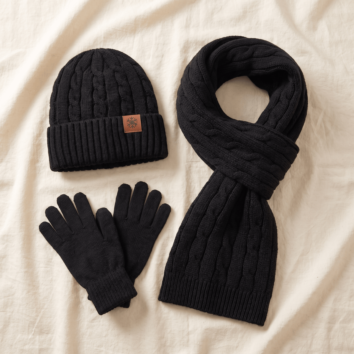 Alpaca Winter Set flat lay - beanie, gloves and scarf on cream linen